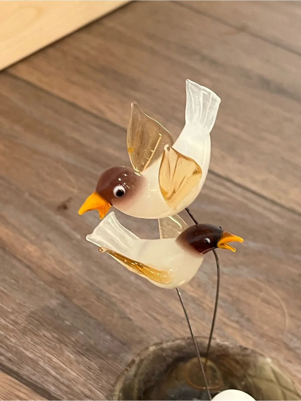 Blown glass bird with nest sculpture